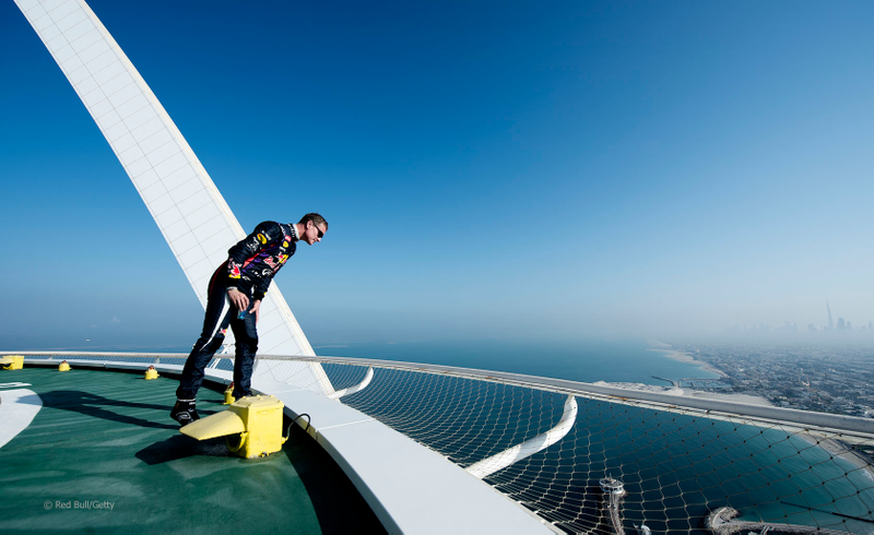Illustration for article titled Red Bull F1 Did Donuts On Top Of The 689-Foot Burj Al Arab Helipad